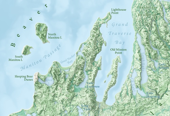 A small portion of the map “Landforms of Michigan” by Daniel Huffman. The image shows the area around the Leelanau Peninsula. The terrain is shown in green tints based on shaded relief, satellite imagery, and land texture, whilst the lakes are shown in shades of light blue according to bathymetry. The various geomorphological features are carefully labelled using curved text.